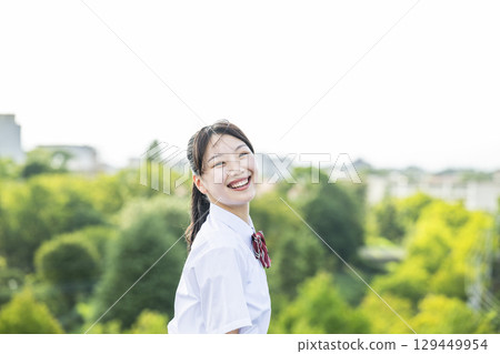 Portrait of a high school girl smiling and looking at the camera 129449954