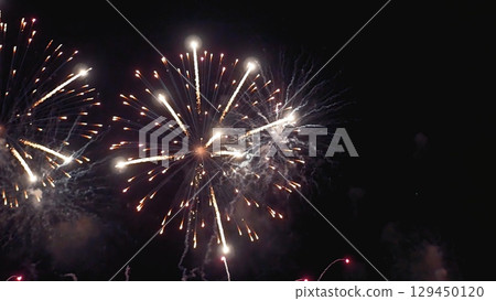 Colorful vibrant Firework celebrate anniversary happy new year 2024, 4th of july holiday festival. colorful firework in night time to celebrate national holiday. countdown new year party background 129450120