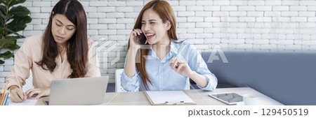 Banner Happy success business woman partner meeting working together in company office. Panoramic picture of Meeting Executive Asian business woman office desk with fist arm raised executive teamwork 129450519