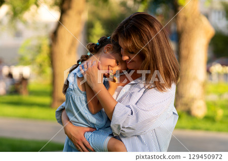Nose-to-nose cuddle with giggling daughter Nose-to-nose cuddle with giggling daughter 129450972