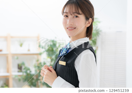 Young woman in uniform, sideways Young woman in uniform, sideways 129451239