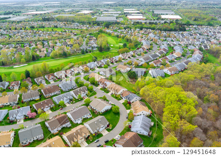 Packed suburban housing development with curved streets, residential community in Middlesex County shows typical American suburban layout with uniform houses 129451648