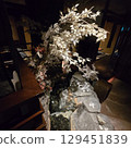 White plum blossoms in the back alley 129451839