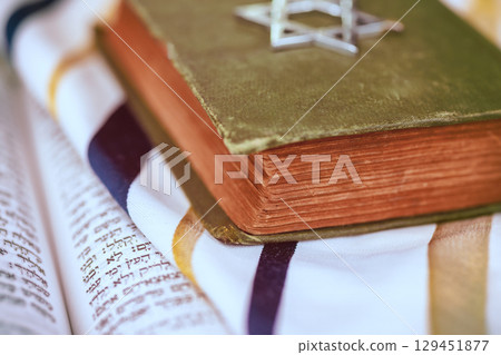 1 August 2025 Jerusalem Israel An ancient religious Jewish text on prayer shawl highlights intricate designs in synagogue at serene setting. "Hebrew Tanakh prayer holy book" 1 August 2025 Jerusalem Israel An ancient religious Jewish text on prayer shawl highlights intricate designs in synagogue at serene setting. "Hebrew Tanakh prayer holy book" 129451877
