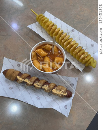 Bunsik, a popular Korean street food, includes various dishes like tteokbokki, odeng, and gimbap. It's a tasty, comforting snack loved by many, perfect for casual gatherings or quick bites. Bunsik, a popular Korean street food, includes various dishes like tteokbokki, odeng, and gimbap. It's a tasty, comforting snack loved by many, perfect for casual gatherings or quick bites. 129451898