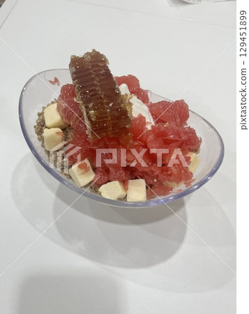 Yo-a-jeong, a traditional Korean cold dessert made from sweetened fruit and shaved ice, offering a refreshing treat perfect for hot summer days. Ideal for showcasing delightful Korean sweets Yo-a-jeong, a traditional Korean cold dessert made from sweetened fruit and shaved ice, offering a refreshing treat perfect for hot summer days. Ideal for showcasing delightful Korean sweets 129451899