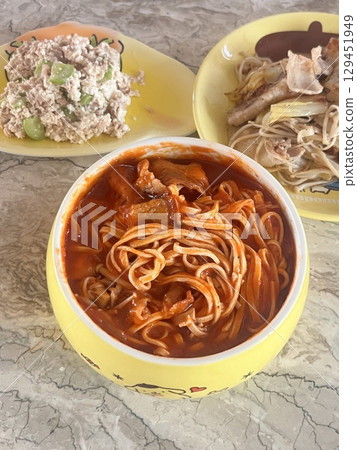 Classic spaghetti coated in rich tomato sauce, offering a simple yet delicious combination of tangy, savory flavors perfect for a comforting meal. Classic spaghetti coated in rich tomato sauce, offering a simple yet delicious combination of tangy, savory flavors perfect for a comforting meal. 129451949