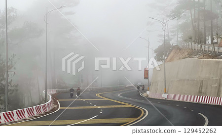 Traffic Vehicles Moving On Prenn Pass At Foggy Morning In Dalat City, Vietnam. 129452262