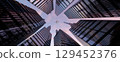 Perspective view to steel light blue of glass high rise building skyscraper city of future and airplane. Business and travel concept of industry tech architecture. 3d rendering. 3d illustration 129452376