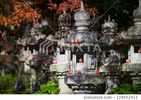 Daruma dolls on lantern at Katsuoji temple garden in autumn, Osaka Daruma dolls on lantern at Katsuoji temple garden in autumn, Osaka 129452411