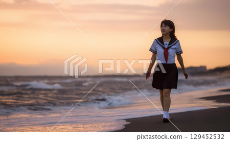 High school girls walking along the beach at sunset High school girls walking along the beach at sunset 129452532