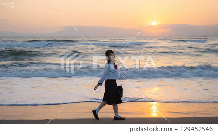 High school girls walking along the beach at sunset High school girls walking along the beach at sunset 129452546