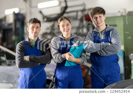 Repair auto mechanic workshop staff. Repair auto mechanic workshop staff. 129452954