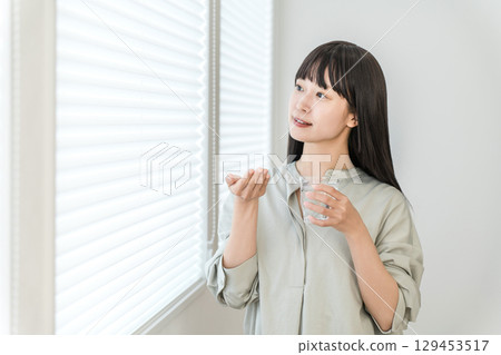 Sick woman taking oral medication, supplements, medicines, medication Sick woman taking oral medication, supplements, medicines, medication 129453517