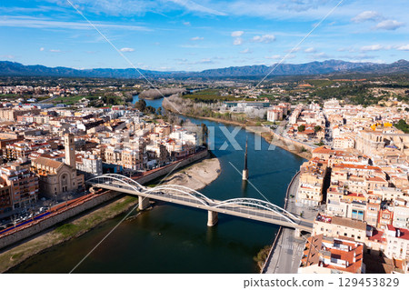 Aerial view of Tortosa overlooking Bridge of State across Ebro river 129453829