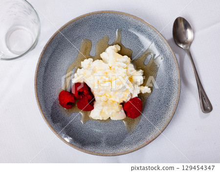 Portion of tradicional Catalan dessert, mato with honey Portion of tradicional Catalan dessert, mato with honey 129454347