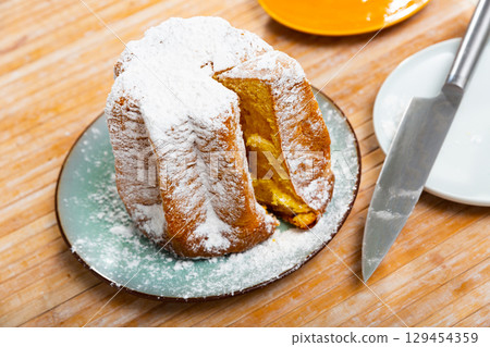 Christmas cake Pandoro with sugar powder Christmas cake Pandoro with sugar powder 129454359