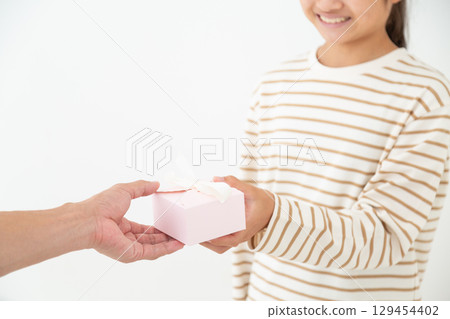 Middle school girl with a gift 129454402
