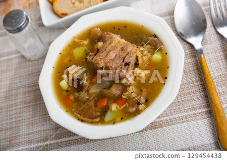 Soup with assorted mushrooms, vegetables and pork Soup with assorted mushrooms, vegetables and pork 129454438
