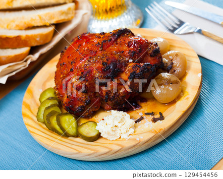 Pork knuckle braised in beer 129454456