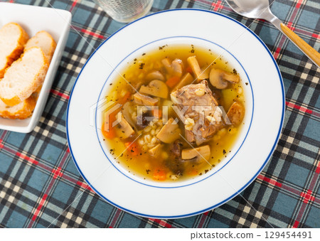 Soup with assorted mushrooms, vegetables and pork Soup with assorted mushrooms, vegetables and pork 129454491