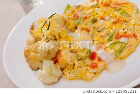 Omelette with cauliflowers 129455211