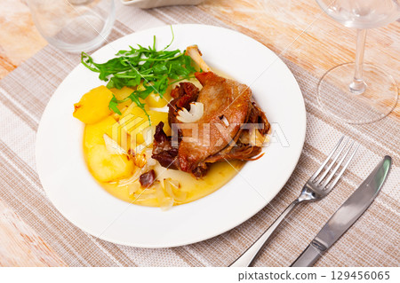 Confit duck with boiled potato and arugula Confit duck with boiled potato and arugula 129456065