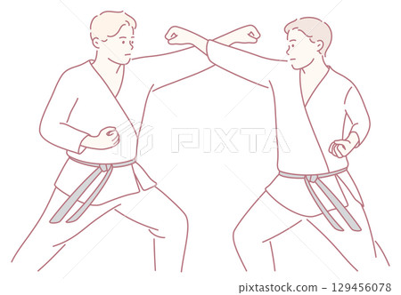 Two skilled martial artists are engaged in an intense sparring technique during practice Two skilled martial artists are engaged in an intense sparring technique during practice 129456078