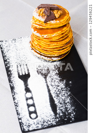 Crepes with chocolate and walnuts Crepes with chocolate and walnuts 129456221