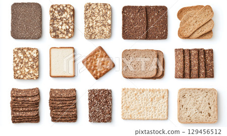 Assortment of diet breads including seed loaf, varieties displayed on white background 129456512