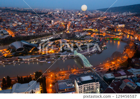 Night aerial view of Tbilisi city with Kura river 129456587