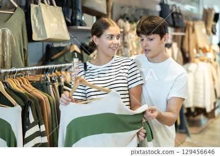 they tried on different jumpers 129456646
