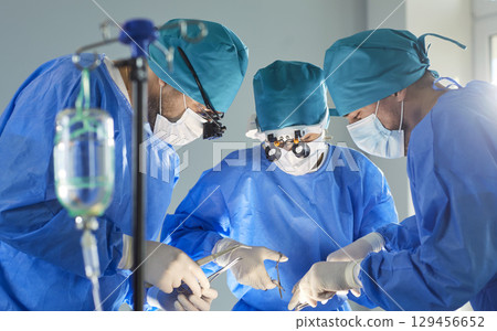 Surgeon Team Operating On Patient In Hospital Surgeon Team Operating On Patient In Hospital 129456652