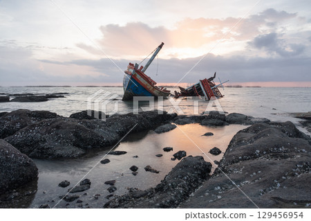 Old wrecked fishing boat on coast of Ang Sila Village, Saensuk Sub-district, Chonburi Province of thailand. Old wrecked fishing boat on coast of Ang Sila Village, Saensuk Sub-district, Chonburi Province of thailand. 129456954