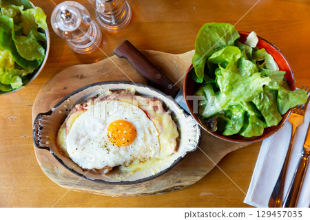 Swiss cheese crust with fried egg 129457035