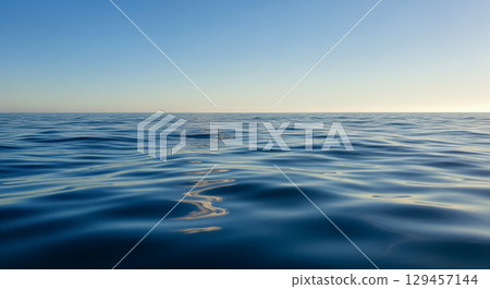 Travel background concept showing calm sea water surface with ripples under clear blue sky, peaceful ocean view at sunset for summer vacation or holiday theme Travel background concept showing calm sea water surface with ripples under clear blue sky, peaceful ocean view at sunset for summer vacation or holiday theme 129457144