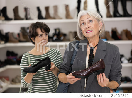 Adult and elderly women choose classic shoes Adult and elderly women choose classic shoes 129457265