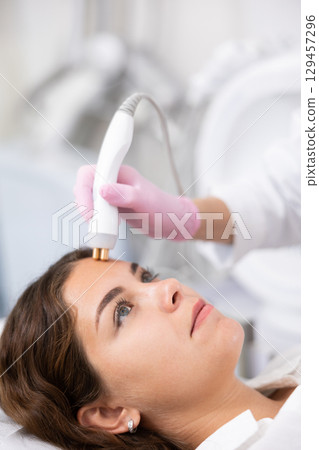 Young woman having face radiolifting procedure Young woman having face radiolifting procedure 129457296