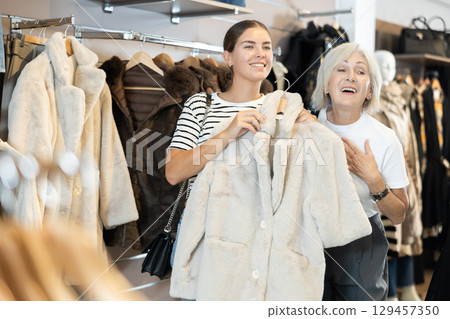 Shoppers take their time examining 129457350