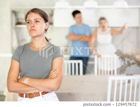 Woman and guy swear at girl. Mom and older brother scold young girl for unsuccessful studies at university. Complex intergenerational relationships Woman and guy swear at girl. Mom and older brother scold young girl for unsuccessful studies at university. Complex intergenerational relationships 129457672