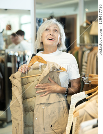 She carefully chooses stylish vest 129457756