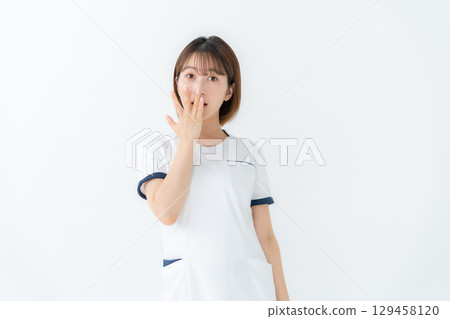 Woman, white coat, nurse, medical, surprised 129458120