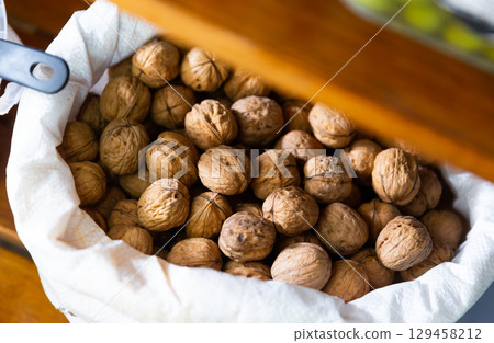 Whole walnuts in box at farmers market 129458212