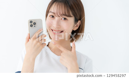 Woman, white coat, nurse, medical, smartphone 129458297