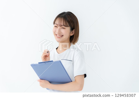 Female white coat nurse medical chart Female white coat nurse medical chart 129458307