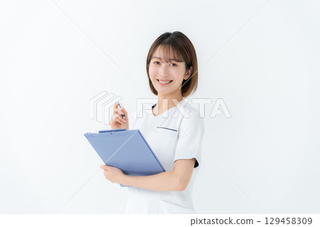 Female white coat nurse medical chart Female white coat nurse medical chart 129458309