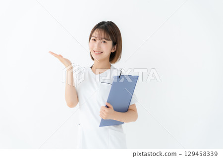 Female white coat nurse medical chart hand-waving Female white coat nurse medical chart hand-waving 129458339
