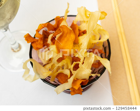 Delicious Yuca chips and Boniato 129458444
