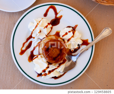 Sweet european dessert flan with whipped cream Sweet european dessert flan with whipped cream 129458605