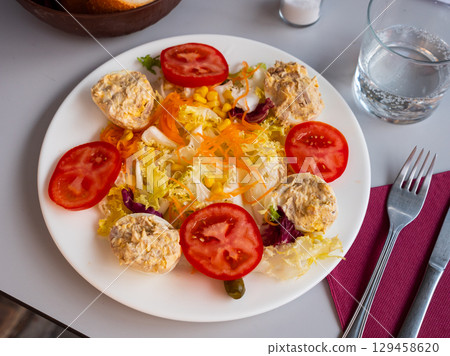 Vegetable salad with stuffed egg halves Vegetable salad with stuffed egg halves 129458620